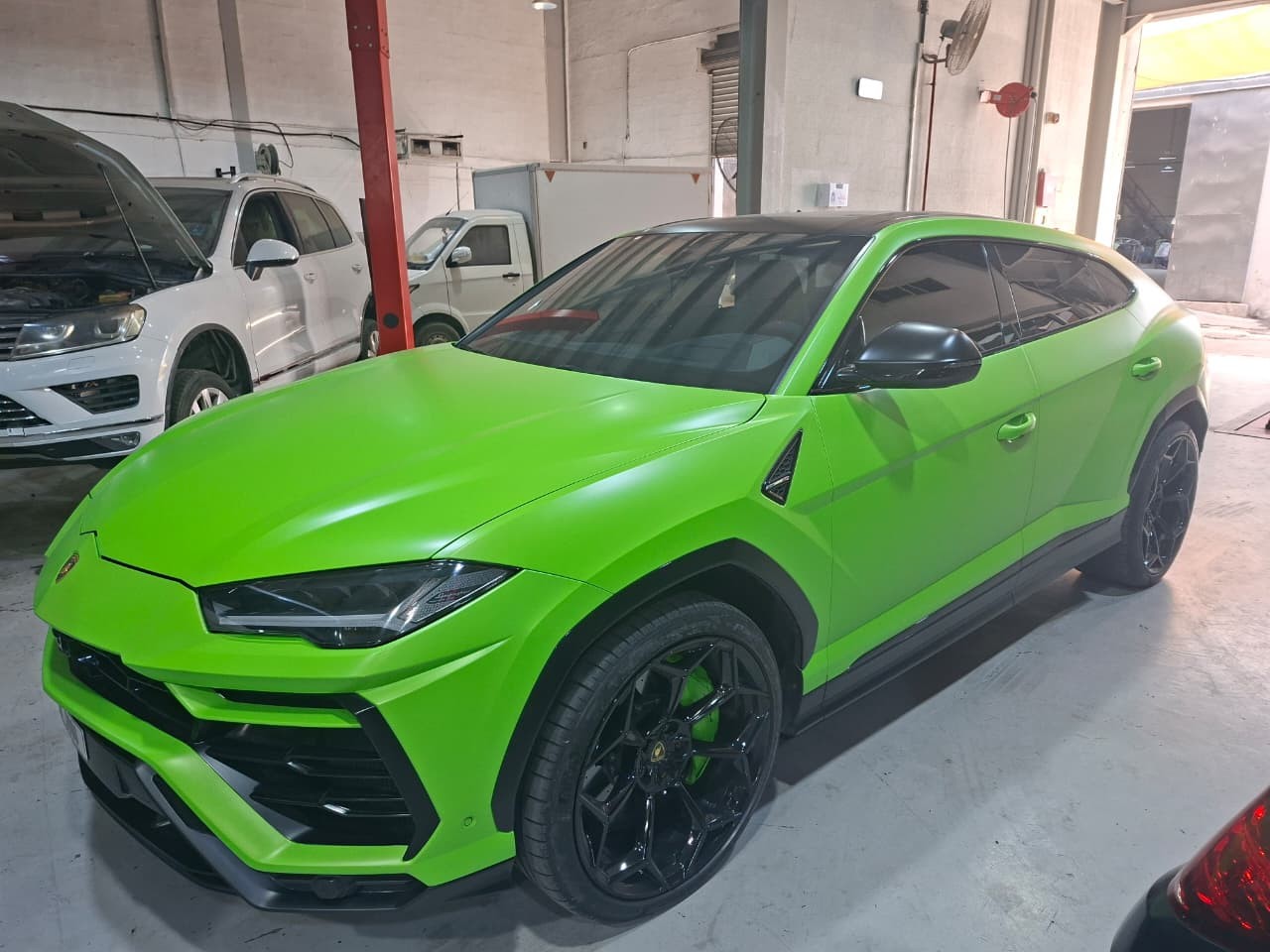 Green Lamborghini front three-quarter view