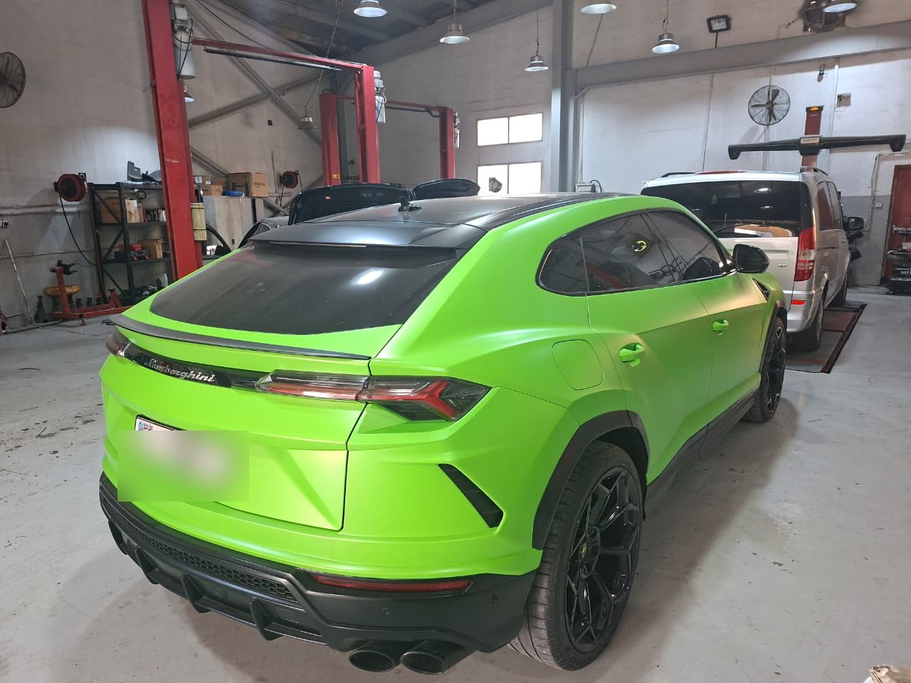 Green Lamborghini rear three-quarter view